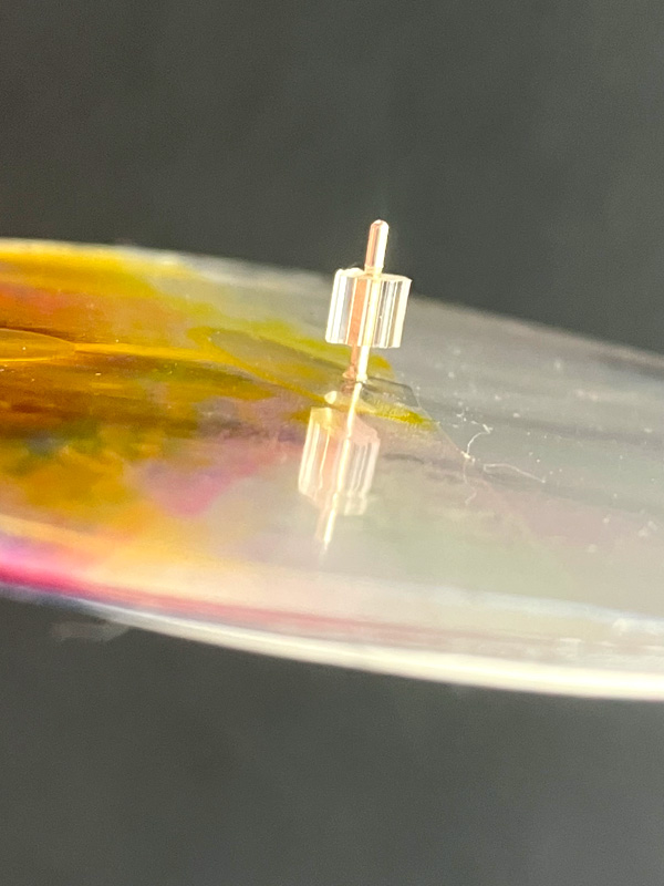 Close-up of vinyl record on turntable spindle