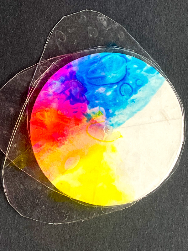 Colourful abstract ink art on circular disc